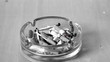 Cigarette falling in ashtray