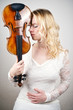 Photo: Woman holds Violine unusual Woman holds Violine unusual