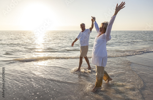 Photo: Happy Senior Couple Holding Hands Sunset Sunrise Beach Happy Senior Couple Holding Hands Sunset Sunrise Beach