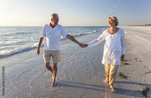 Photo: Happy Senior Couple Walking Holding Hands Tropical Beach Happy Senior Couple Walking Holding Hands Tropical Beach