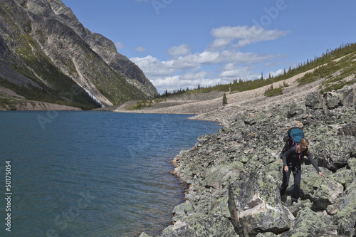 Photo: Caucasian woman hiking near lake Caucasian woman hiking near lake