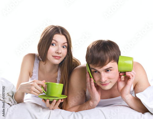 Photo: young couple in bed with communication problems young couple in bed with communication problems