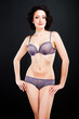 Foto: girl in lacy underwear on black background girl in lacy underwear on black background