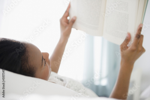 Photo: Black woman reading a book Black woman reading a book