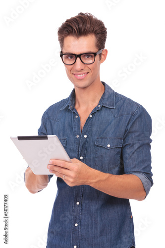 Photo: man with tablet smiles at you man with tablet smiles at you