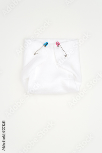 Photo: Old-fashioned pins in cloth diaper Old-fashioned pins in cloth diaper