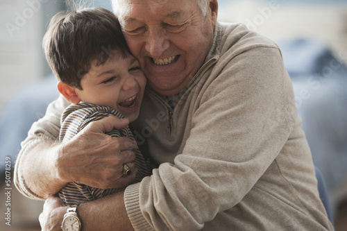 Photo: Caucasian man hugging grandson Caucasian man hugging grandson