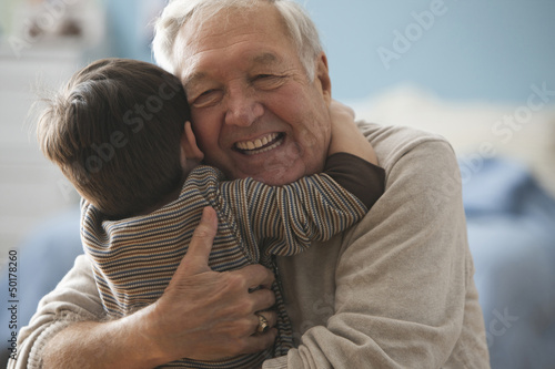 Photo: Caucasian man hugging grandson Caucasian man hugging grandson