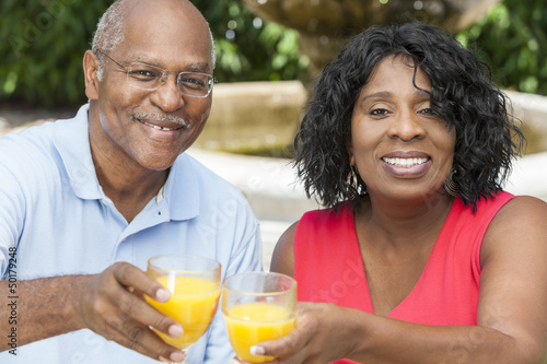 Photo: Senior African American Couple Drinking Orange Juice Senior African American Couple Drinking Orange Juice