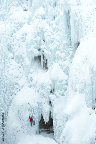 Photo: Caucasian man climbing ice Caucasian man climbing ice