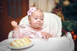 Little girl with a sweet cake in birthday