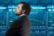businessman with beard and black suit in the stockmarket, back