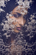 portrait of beauty young woman through lace