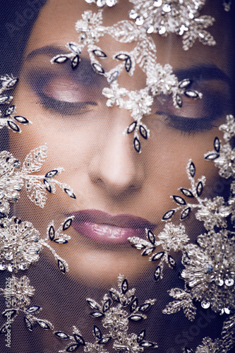 Photo: portrait of beauty young woman through lace portrait of beauty young woman through lace