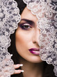 portrait of beauty young woman through lace
