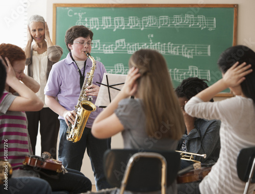 Photo: Student playing saxophone badly Student playing saxophone badly