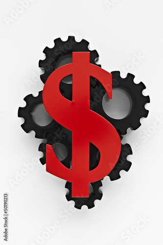 Photo: Dollar sign on top of cogs Dollar sign on top of cogs