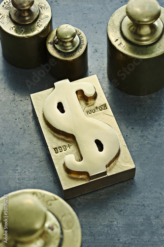 Photo: Gold ingot with dollar sign symbol Gold ingot with dollar sign symbol