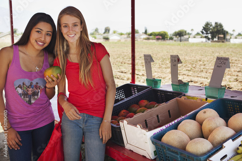 Photo: Teenage girls shopping at fruit stand Teenage girls shopping at fruit stand