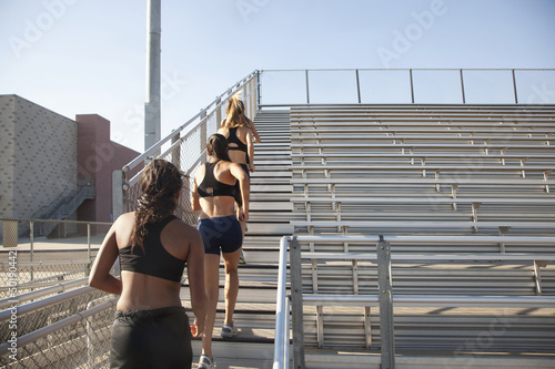 Photo: Teenage runners training on stadium bleachers Teenage runners training on stadium bleachers