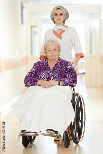 Photo: Nurse with elderly patient in wheelchair Nurse with elderly patient in wheelchair