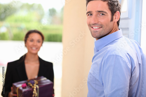 Photo: Woman delivering gift Woman delivering gift