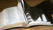 Bible pages turning in the wind