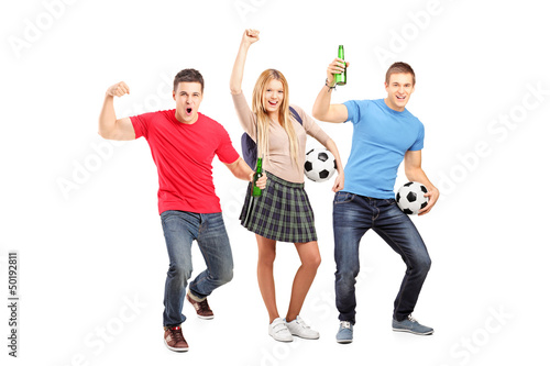 Photo: A group of young football supporters cheering A group of young football supporters cheering