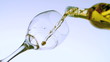 White wine pouring into glass low angle view