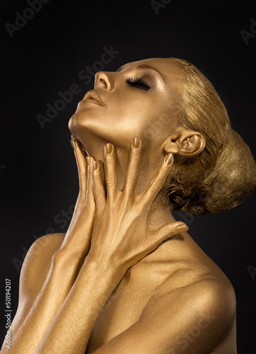 Photo: Coloring. Gilt. Golden Woman's Face. Art concept. Gilded Body Coloring. Gilt. Golden Woman's Face. Art concept. Gilded Body
