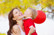 Little boy kissing mom