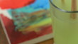 Painting on paper with red and cleaning a brush