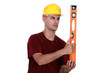 craftsman holding a level