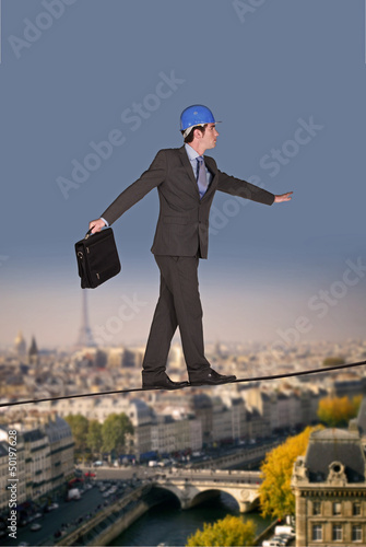 Photo: Businessman walking on a tightrope Businessman walking on a tightrope