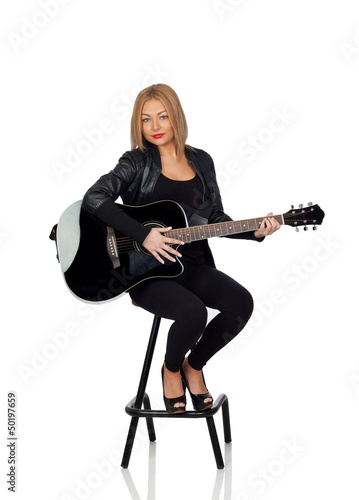 Photo: Sexy guitarist sitting with a black leather jacket Sexy guitarist sitting with a black leather jacket