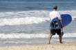 Surfer walking