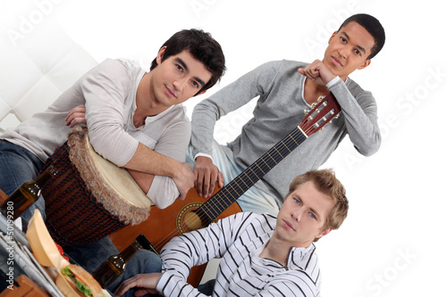 Photo: Young men jamming with instruments Young men jamming with instruments