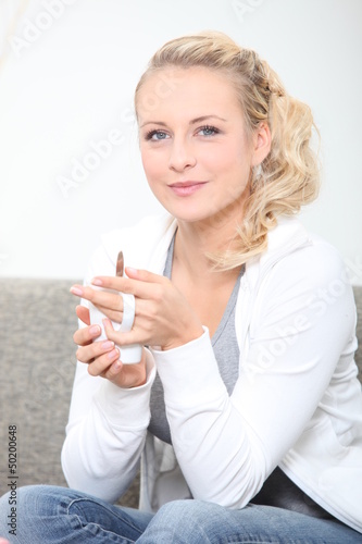 Photo: Woman with coffee cup Woman with coffee cup