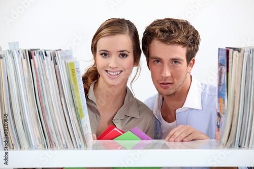 Photo: Young couple in library Young couple in library