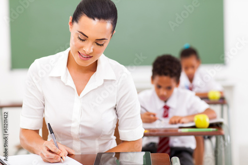 Photo: teacher preparing lessons in classroom teacher preparing lessons in classroom