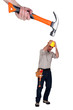Scared builder shielding himself from giant hammer