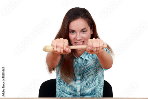 Photo: Girl holding paintbrush Girl holding paintbrush