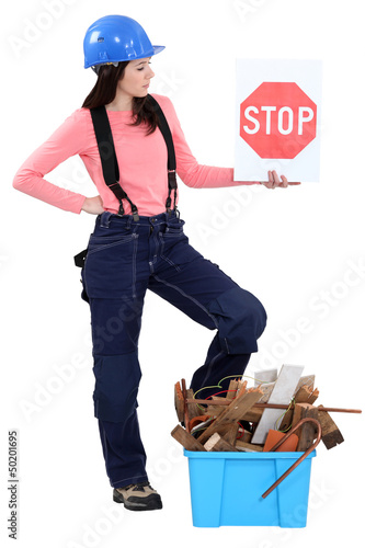 Photo: Woman with box of debris Woman with box of debris