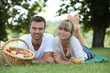 Couple with a basket of fruit