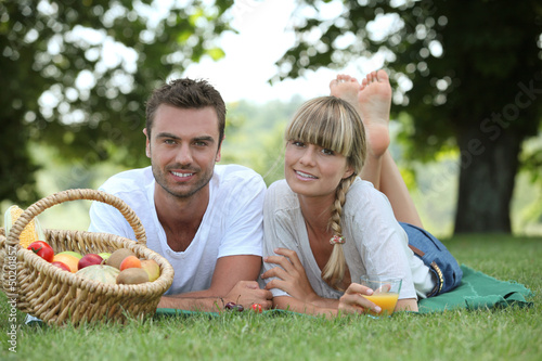 Photo: Couple with a basket of fruit Couple with a basket of fruit