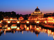 Night view of the Vatican across the Tiber River of Rome, Italy