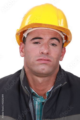 Photo: A bored construction worker. A bored construction worker.