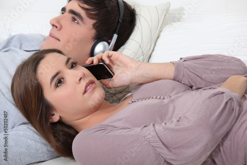 Photo: Couple relaxing on sofa Couple relaxing on sofa