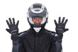Motorcyclist wearing black jacket, gloves and helmet