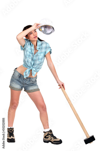 Photo: Sweating young woman with mace Sweating young woman with mace